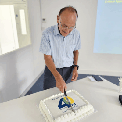 Max cutting 40th anniversary cake